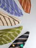 Assorted Derby stripe jersey fabrics in various colors displayed on a white background.