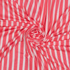 Close-up of pink and white striped fabric in a swirl pattern