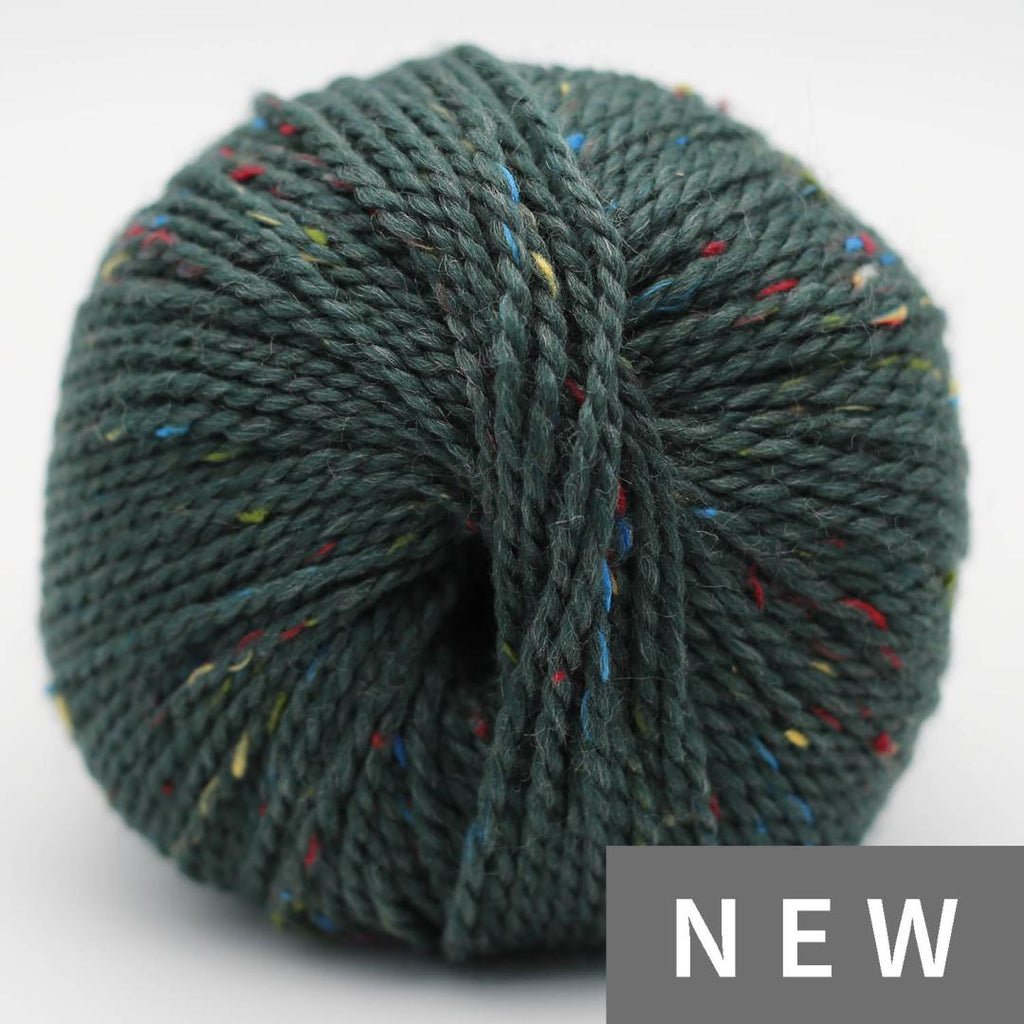 Green skein of yarn with multicolored speckles on a white background, labeled 'NEW'.