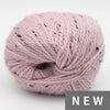 Pink yarn ball with speckles on a light gray background, labeled 'NEW'.