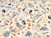 Patterned fabric with cartoonish designs on a beige background