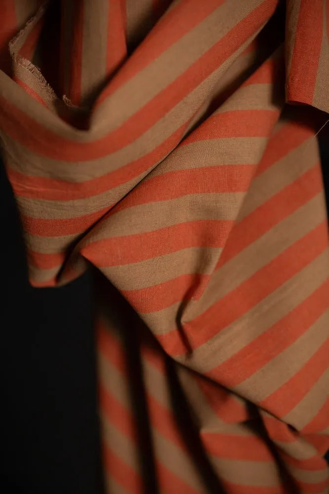 Close-up of orange and beige striped fabric