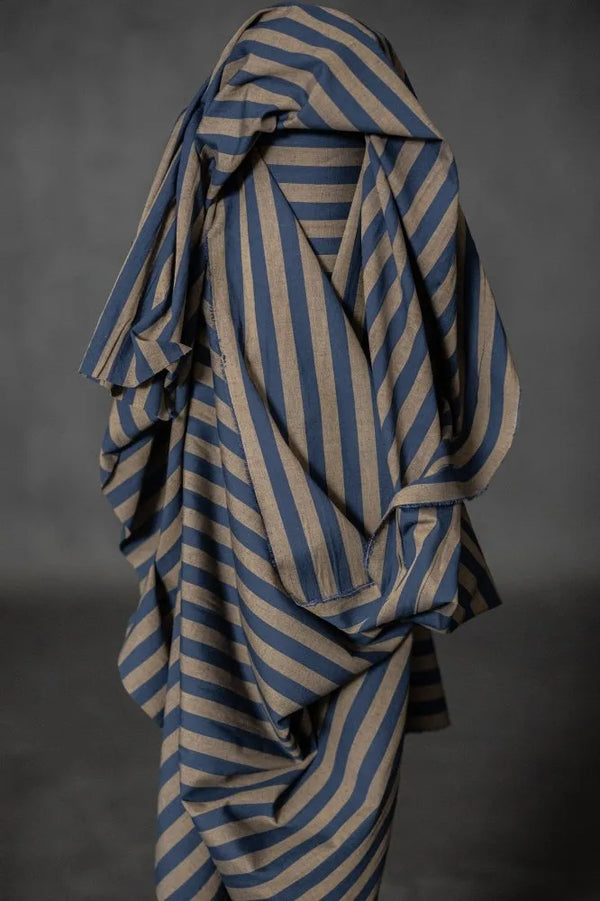 Striped fabric draped over a gray background