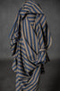 Striped fabric draped over a gray background