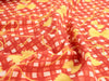 Red fabric with yellow and white pattern