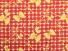 Red and white checkered fabric with yellow bow patterns