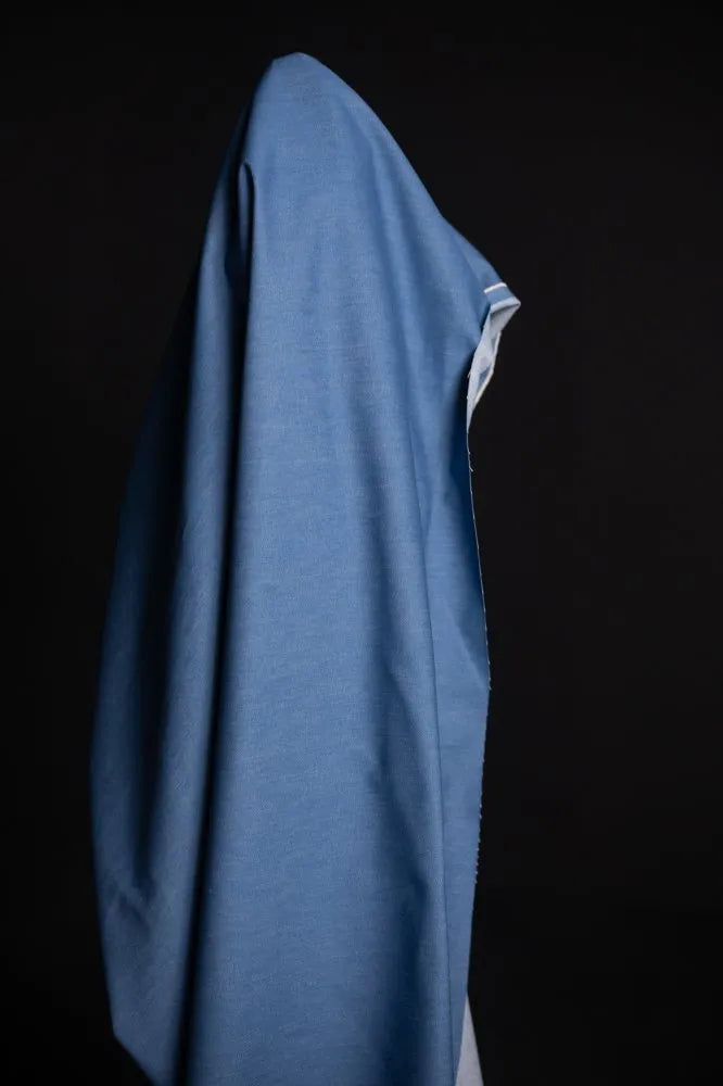 Blue garment on a black background
