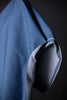 Close-up of blue fabric with a dark background