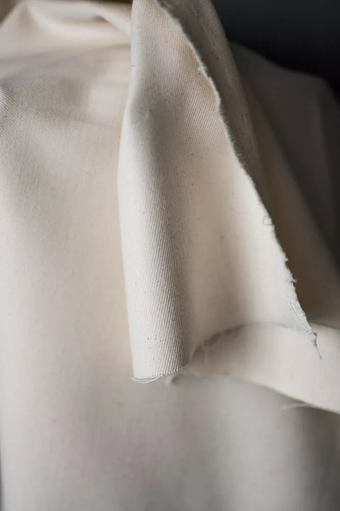 Close-up of beige fabric with a textured surface