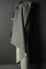 Gray fabric draped over a dark surface