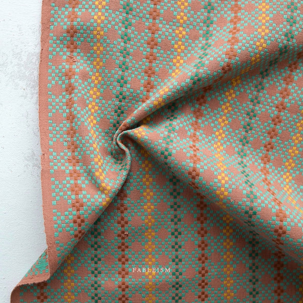 Patterned fabric with a geometric design on a white background