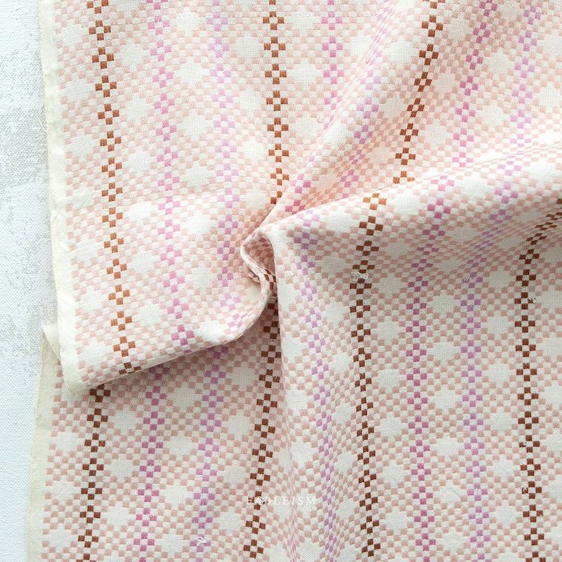Close-up of pink and brown patterned fabric