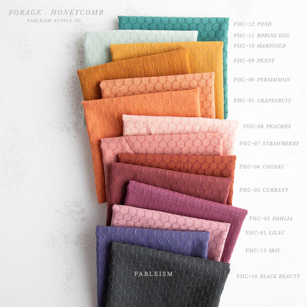 a rainbow selection of colours of fabric squares
