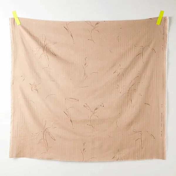 a swatch of beige cotton fabric