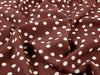 Brown fabric with white polka dots