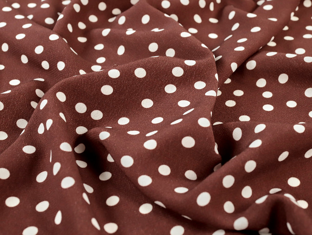 Brown fabric with white polka dots