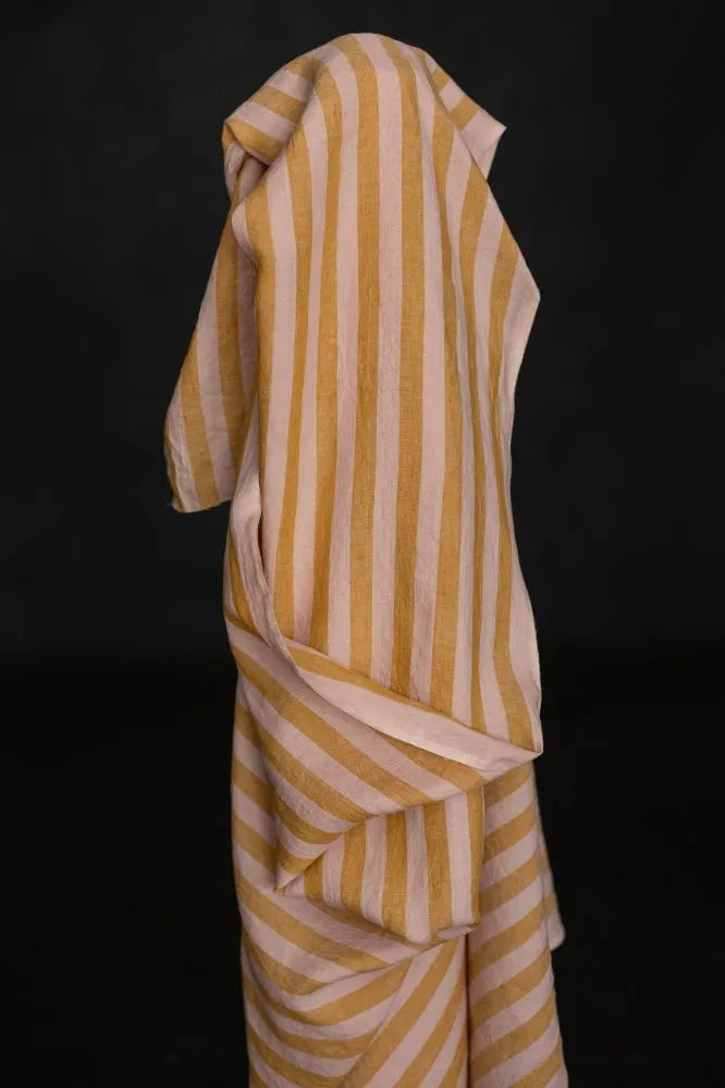 Striped fabric with yellow and white pattern on a black background