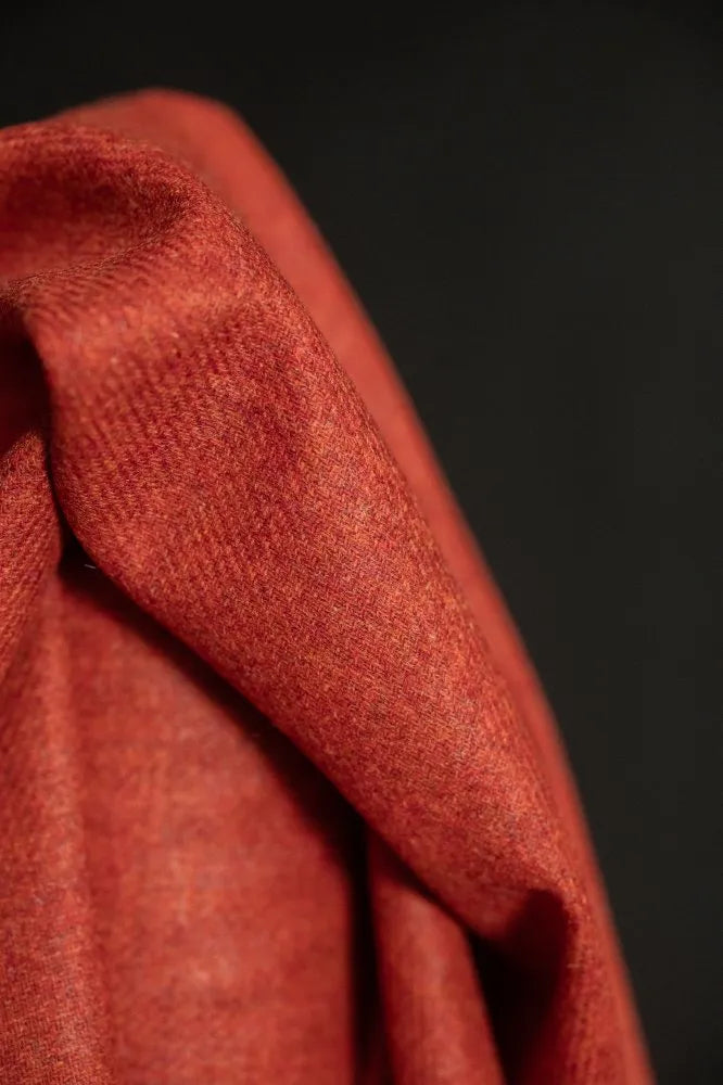 Close-up of red fabric with a dark background