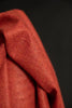 Close-up of red fabric with a dark background