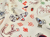 Fabric with vintage-style tattoo designs on a white background