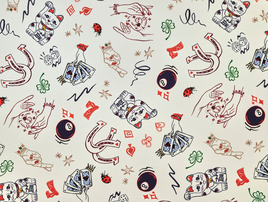 Pattern of lucky charms and symbols on a white background