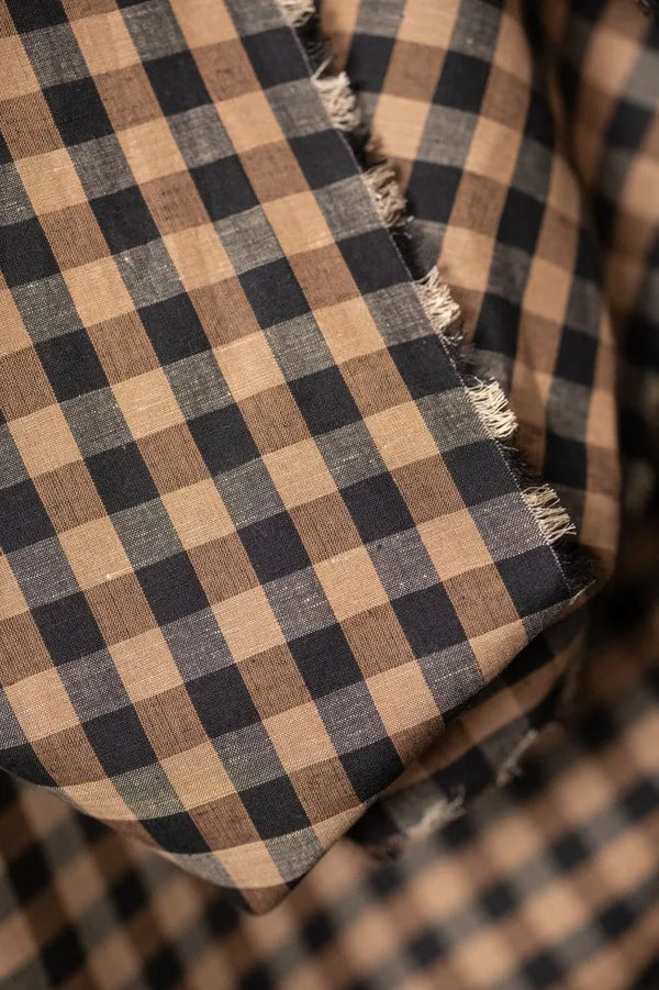Close-up of a checkered fabric with brown and black pattern