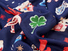 Navy blue fabric with playing card suits and shamrock pattern
