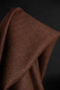 Close-up of brown fabric with a dark background