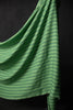 A wide stripe linen fabric in two shades of bright green, displayed on a dark background.