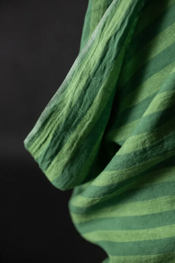 a close-up of green striped fabric