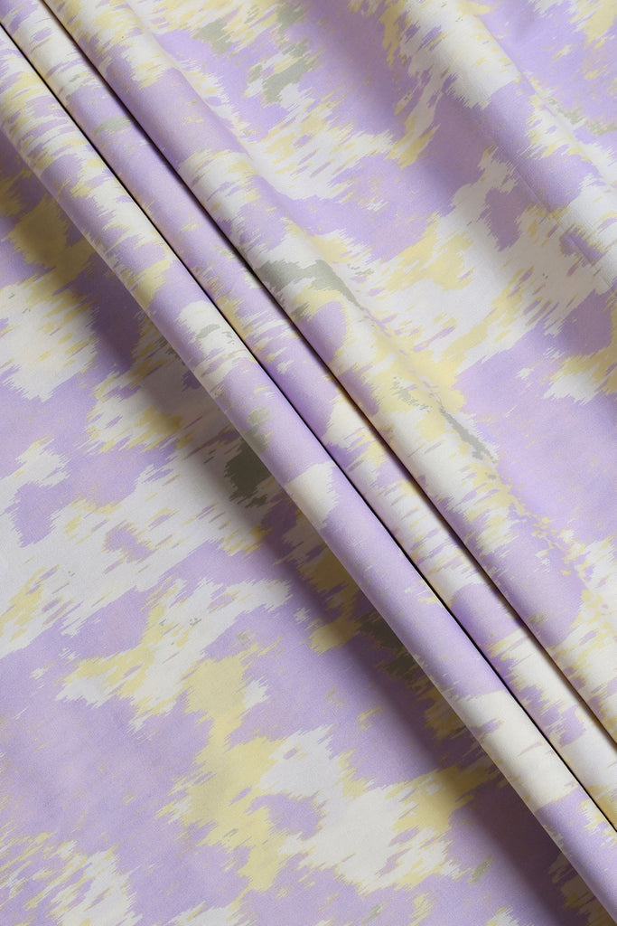 Roll of purple and yellow patterned paper