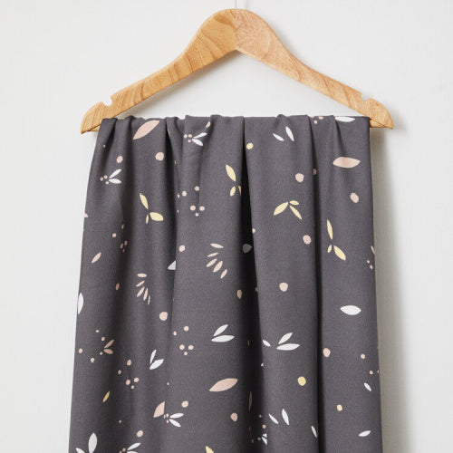 a swatch of fabric draped on a hanger