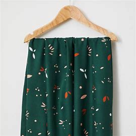 a swatch of green fabric on a  hanger