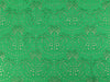 Patterned fabric with a green background and beige design