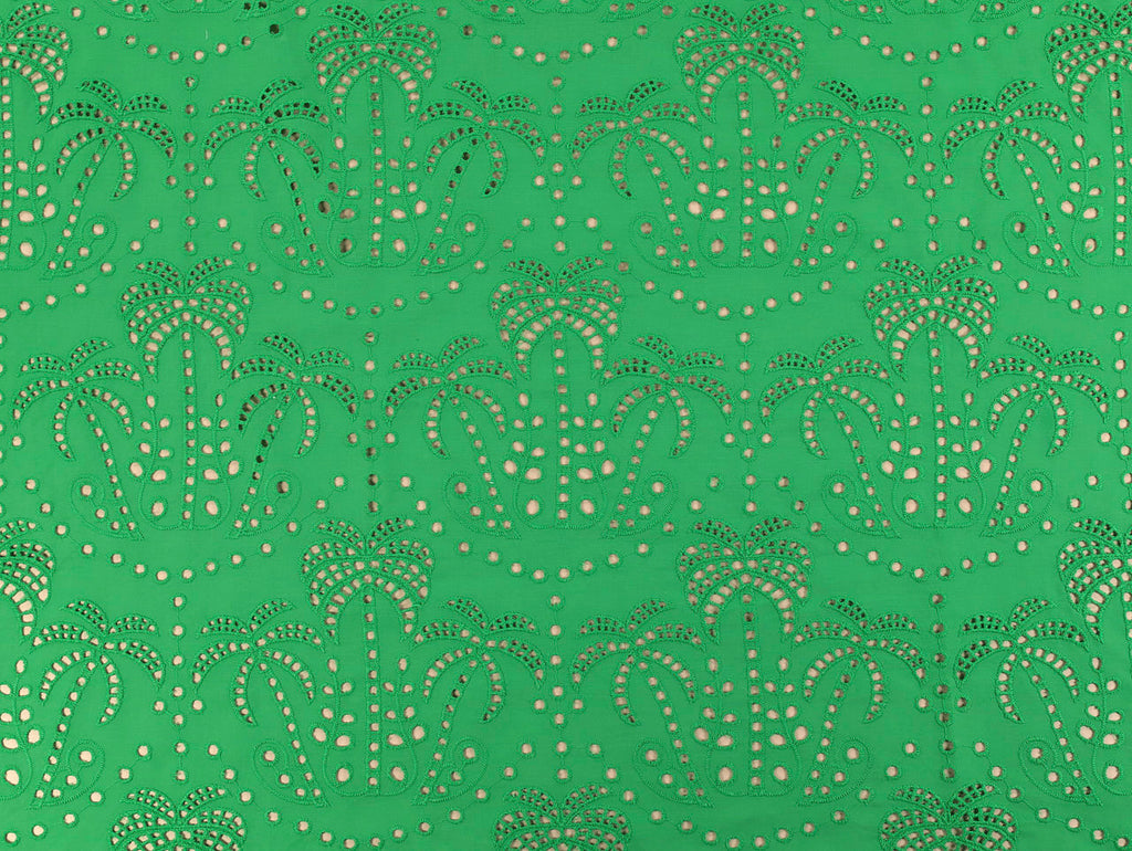 Patterned fabric with a green background and beige design