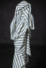 Striped fabric with blue and white pattern on a black background