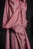 Red and white checkered fabric on a dark background