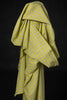 Yellow checkered fabric draped over a black background