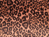 Leopard print pattern on a textured fabric background