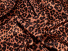 Leopard print fabric with brown and black spots