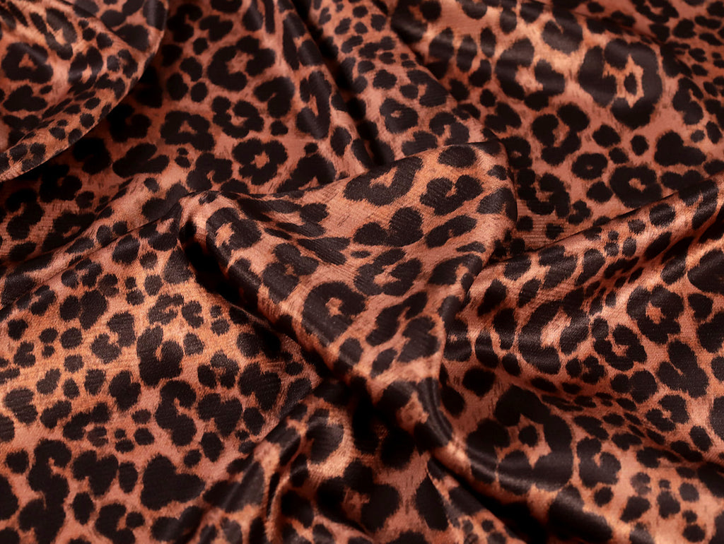 Leopard print fabric with brown and black spots