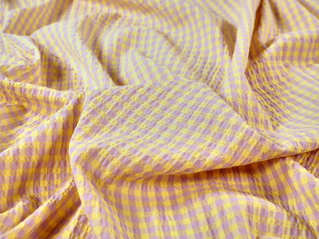 Close-up of yellow and purple checkered fabric