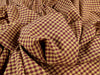 Close-up of crumpled purple and yellow checkered fabric