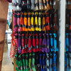 Colorful skeins of embroidery floss on display in a store.