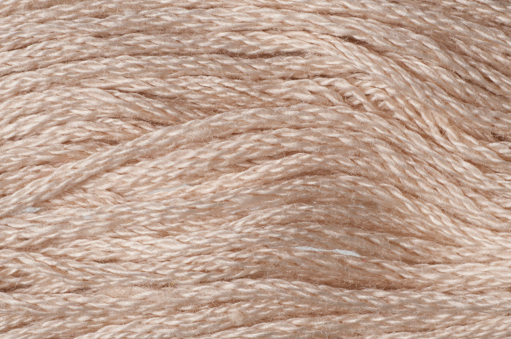 Close-up of beige yarn texture