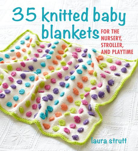 A knitted baby blanket with multicolored squares and a green border, folded to showcase the blanket's pattern and texture.
