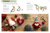 A knitting instruction page showing French knot and chain stitch diagrams at the top, with a large photo below of handmade knitted holiday figures, yarn balls, needles, scissors, and ornaments arranged on a wooden surface.