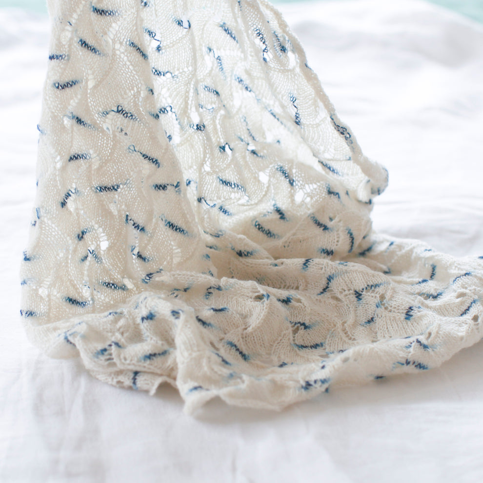 White fabric with blue patterns on a white background