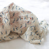 Knitted fabric with a subtle pattern on a white background