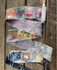 Collection of patchwork flags on a wooden surface